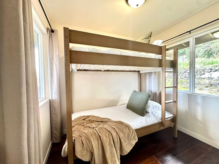 Bunk beds beside corner windows at H5 Blue Lagoon of Kona Estate