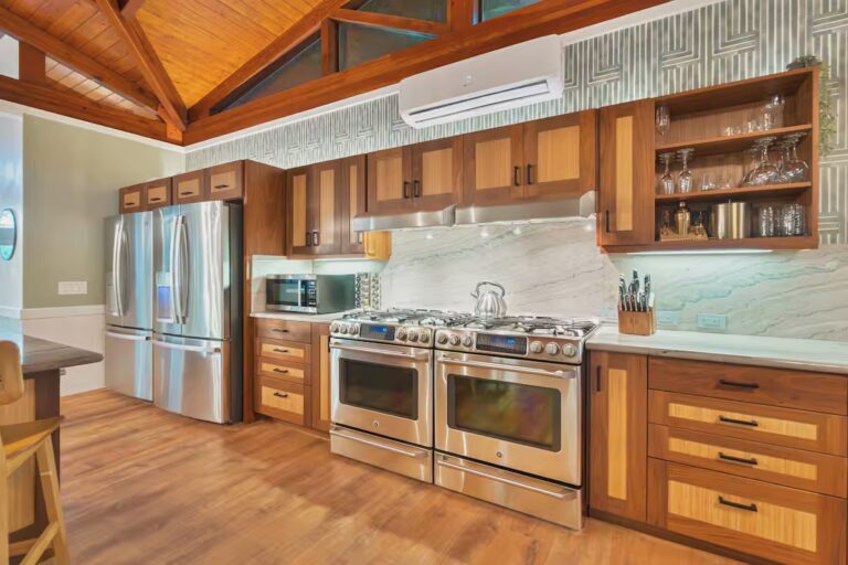 Kitchen with wood cabinets and two ranges at Spacious Kona Retreat
