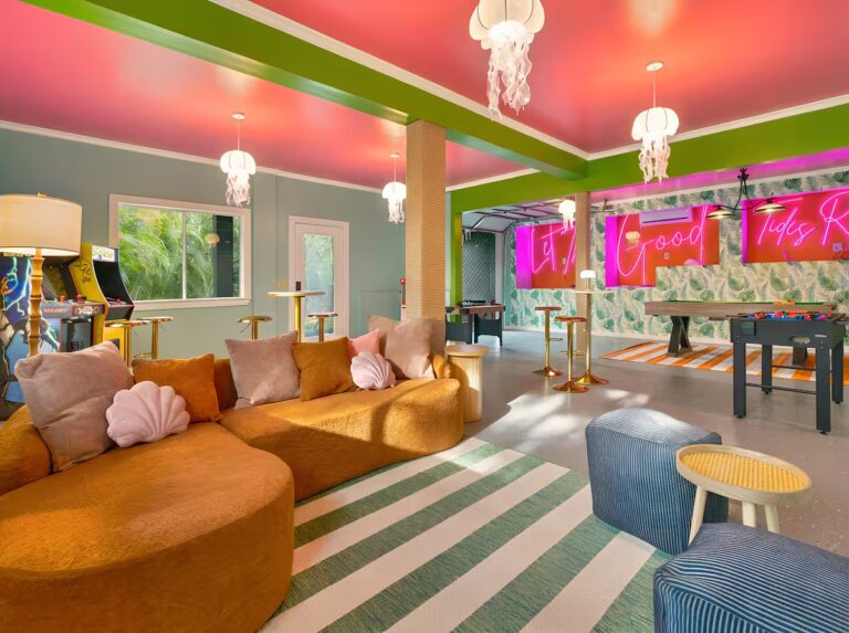 Lounge seating beside the game room at Spacious Kona Retreat