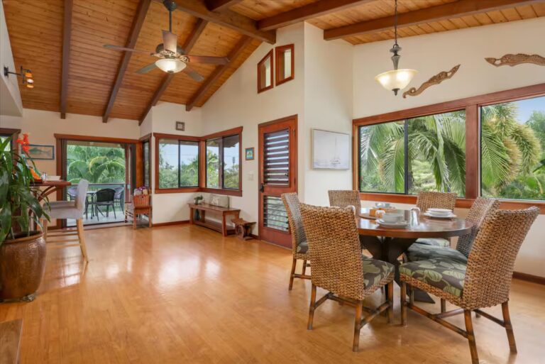 Open dining area beneath a vaulted wood ceiling at H6 Dolphin Bay Estate