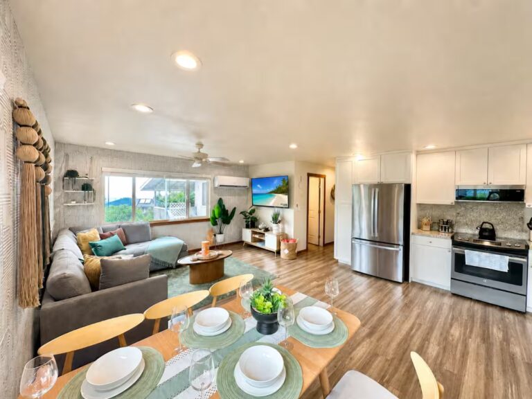 Open kitchen and living space viewed from the dining table at HI8 Kona vacation home