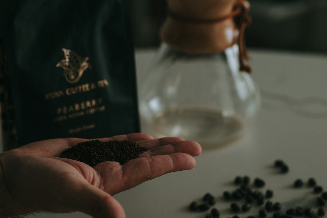 Fresh coffee grounds held in a hand
