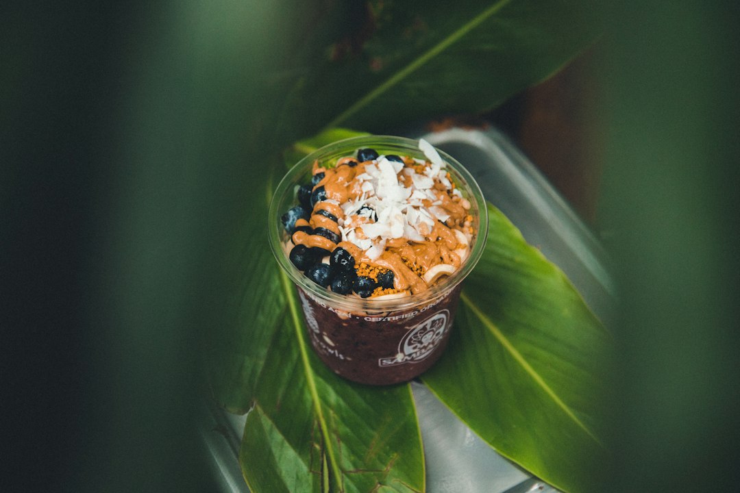 Fruit bowl with berries and coconut on a leaf