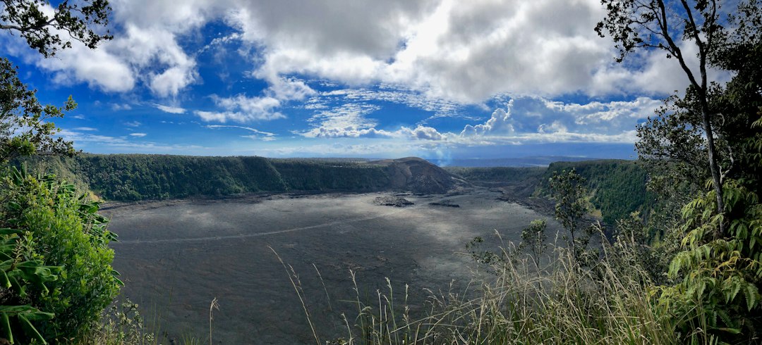 Kilauea crater panorama with an eruption plume