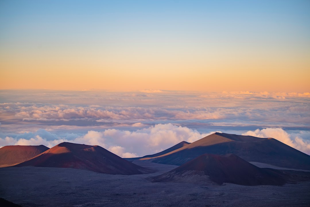 Maunakea summit landscape above a layer of clouds