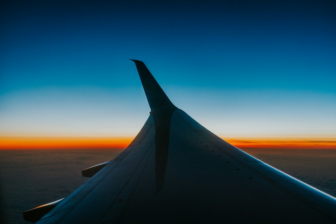 Pacific sunset seen from an airplane window