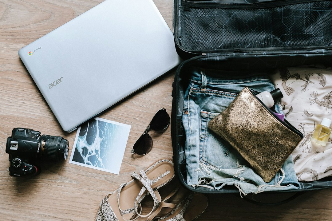 Packing clothes and a laptop for a trip