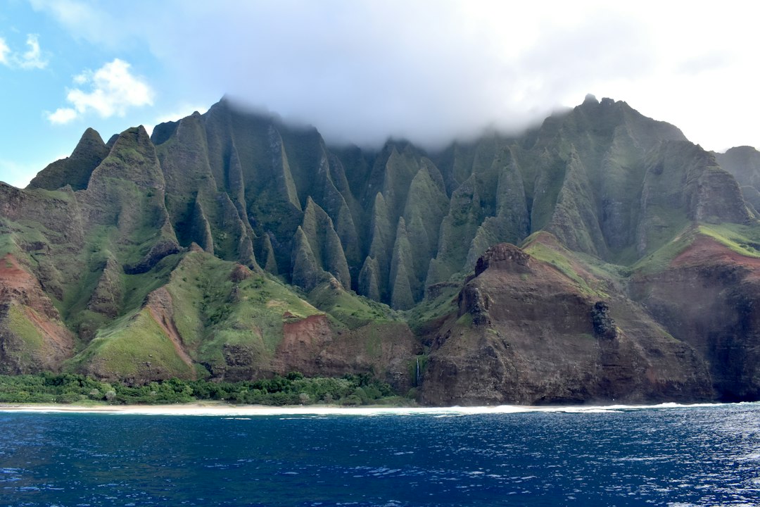Steep green cliffs along the Napali Coast
