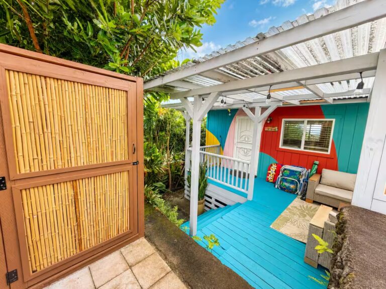 Colorful porch with a turquoise deck and bamboo screening at HI8 Kona vacation home
